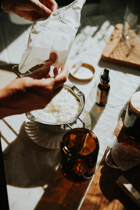 Person using House of EQ candle making kit
